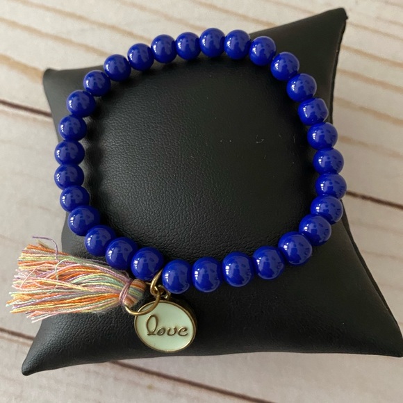 NWOT 💫COBALT BLUE STRETCH ELASTIC BRACELET WITH TASSEL AND LOVE PENDANT - Picture 1 of 11